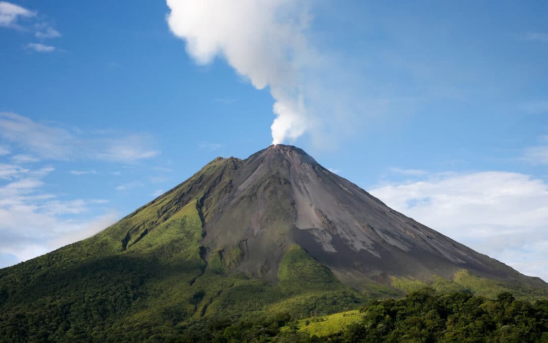 Arenal volcano in costa rica with a plume of smoke